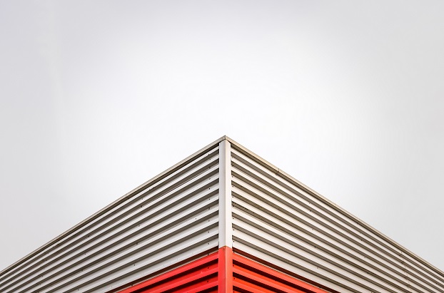 Abstract Architecture Detail Of A Factory Roof Corner Against An Overcast Sky With Copy Space