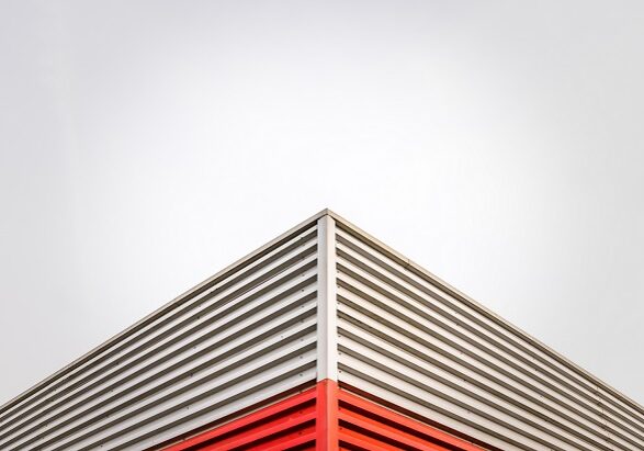 Abstract Architecture Detail Of A Factory Roof Corner Against An Overcast Sky With Copy Space
